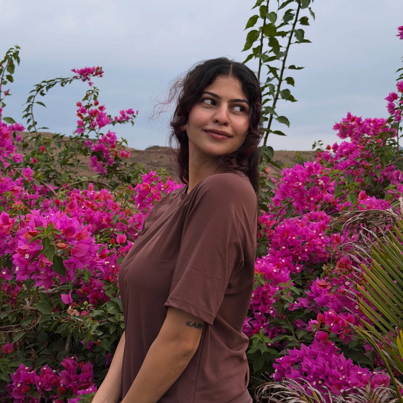 Shreya Jadhav photographed among bright bougainvillea